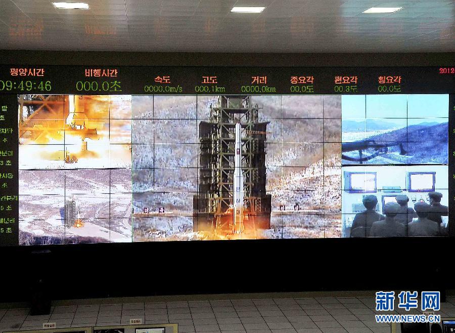 金正恩亲临现场指挥朝鲜卫星发射图片