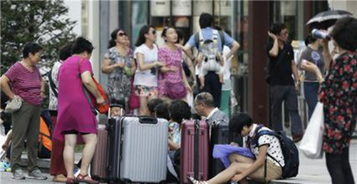中国人赴日或免签 日本副外相称中国的发展不